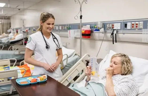 Nursing Student working with patient